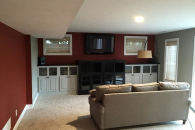 Inspiration for a mid-sized timeless enclosed carpeted and beige floor living room remodel in Chicago with a bar, gray walls, no fireplace and a wall-mounted tv