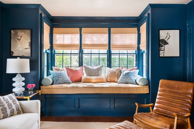 Inspiration for a mid-sized timeless medium tone wood floor living room remodel in Orange County with blue walls
