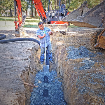 Foreman Managing a Major Drain Installation