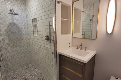Example of a small eclectic 3/4 single-sink bathroom design in Philadelphia with dark wood cabinets, a one-piece toilet, a hinged shower door and a freestanding vanity