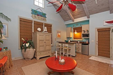 Small beach style open concept porcelain tile living room photo in Dallas with blue walls and a concealed tv