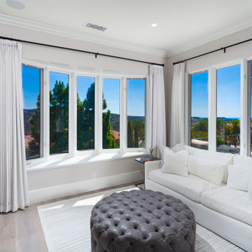 Primary Suite Sitting Room with Limestone Slab Fireplace & Ocean View – Newport 