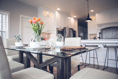 Inspiration for a mid-sized contemporary light wood floor and beige floor great room remodel in Other with gray walls and no fireplace