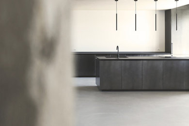 Example of a minimalist gray floor living room design in Milan