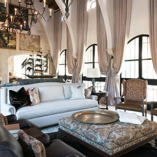 Inspiration for a large mediterranean formal enclosed living room in Jacksonville with limestone flooring, a standard fireplace, a plastered fireplace surround and no tv.