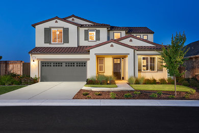 Contemporary white two-story stucco exterior home idea in Denver