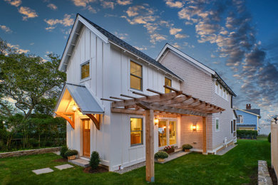 Small elegant gray two-story wood and shingle gable roof photo in New York with a shingle roof