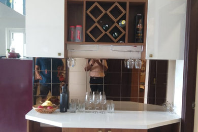 Example of a trendy home bar design in Bengaluru