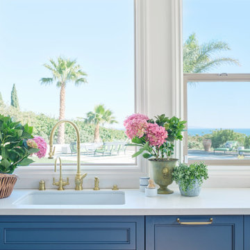 Kitchen Sink with Ocean View and Brass Fixtures