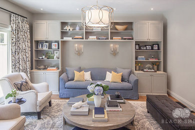 Inspiration for a huge transitional open concept light wood floor living room library remodel in Toronto with gray walls, no fireplace and no tv