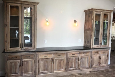 Example of a mountain style living room design in Calgary with no fireplace