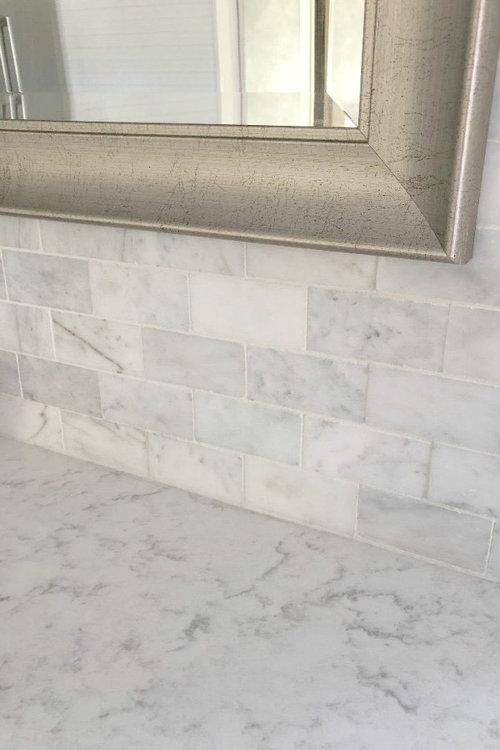 Can you use carrera marble as a backsplash in a farmhouse kitchen?