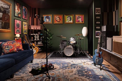Inspiration for a small eclectic enclosed vinyl floor, brown floor and wall paneling family room remodel in Milwaukee with a music area, green walls and no tv