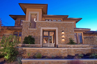 Huge traditional brown three-story mixed siding flat roof idea in Las Vegas