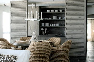 This is an example of a beach style dining room in Miami.