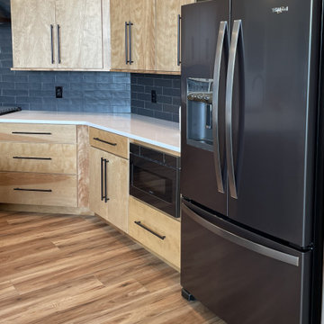 Angled Kitchen Design with Slab Style Cabinets in Pecan Stain