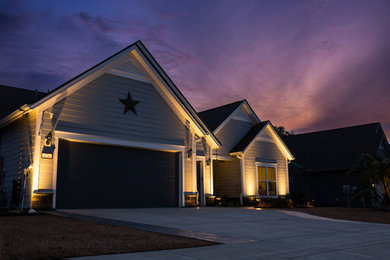 Design ideas for a mid-sized coastal partial sun front yard concrete paver landscaping in Charleston.
