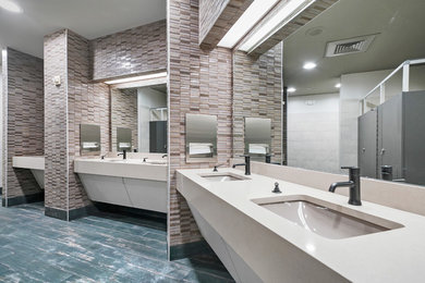 Inspiration for a huge contemporary multicolored tile and glass tile ceramic tile and blue floor bathroom remodel in Houston with white cabinets, a wall-mount toilet, multicolored walls, an undermount sink, quartzite countertops and white countertops
