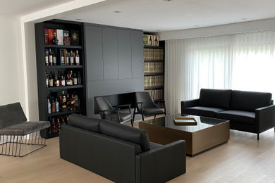 Living room - mid-sized open concept light wood floor and beige floor living room idea in Montreal with a hanging fireplace and no tv