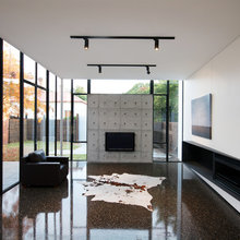 polished grey concrete with a black oxide adde to the mix. Bluestone an