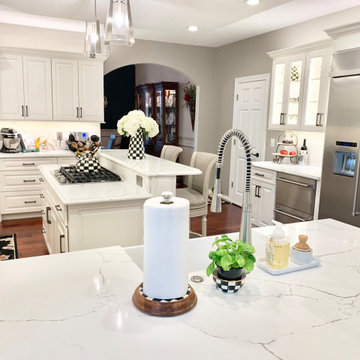 Ivory White Kitchen With Marble Look Quartz Counters and Splash