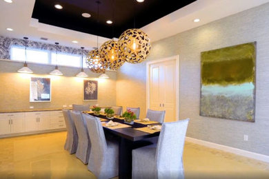 Large transitional marble floor, beige floor, tray ceiling and wallpaper enclosed dining room photo in Miami with gray walls