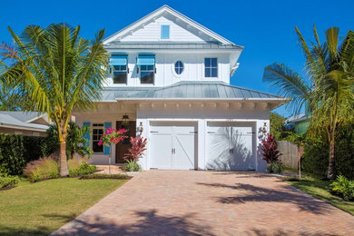 Mid-sized coastal white two-story stucco exterior home idea in Miami