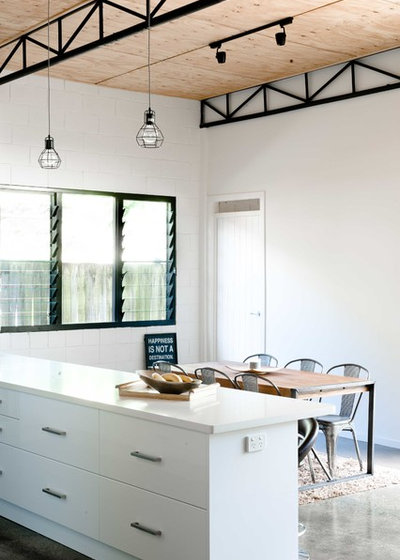 Industrial Dining Room by ARCO Designs