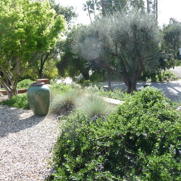 Adjacent the entry drive with fountain urn