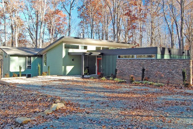 Inspiration for a mid-century modern exterior home remodel in Raleigh