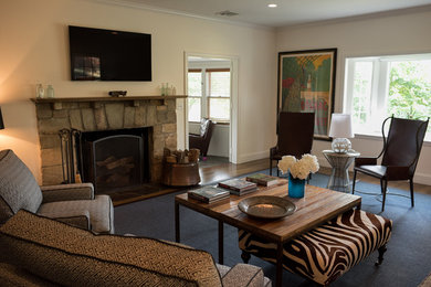 Example of a mid-sized transitional enclosed dark wood floor living room design in New York with a music area, white walls, a standard fireplace, a stone fireplace and a wall-mounted tv
