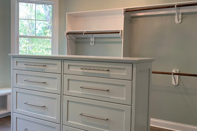Example of a minimalist closet design in Other
