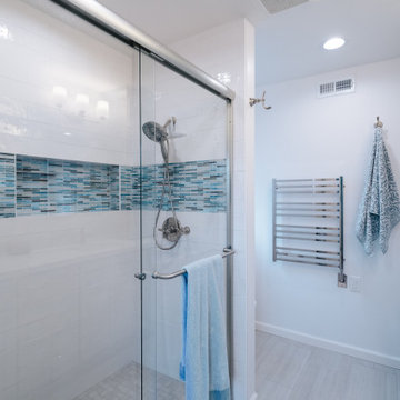 Alcove shower with built-in hideaway niche