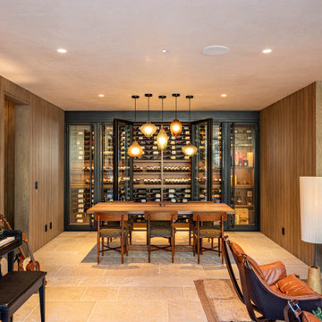Modern Bronze Steel Wine Wall and Liquor Display in Luxury Custom Home Basement