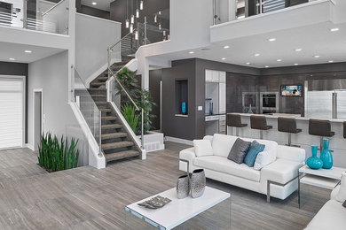 Inspiration for a contemporary open concept gray floor living room remodel in Edmonton with gray walls