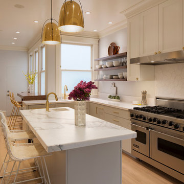 Contemporary Kitchen with Calacatta, Walnut, & Brass