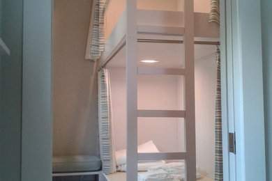 Small room bunk bed with privacy drapes