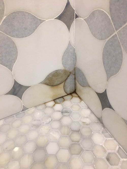 could bad grout cause stains in marble?