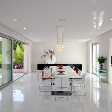 Glass lighting defining the dining area within a bright open-plan home