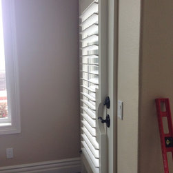 Shutters in transitional space. - Window Treatments