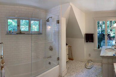 Example of a mid-sized transitional white tile and subway tile mosaic tile floor, white floor and single-sink bathroom design in Sacramento with furniture-like cabinets, gray cabinets, gray walls, an undermount sink, marble countertops, a hinged shower door, gray countertops and a freestanding vanity