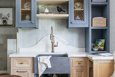 Inspiration for a mid-sized contemporary galley utility room in Los Angeles with an undermount sink, shaker cabinets, blue cabinets, marble benchtops, blue walls, a side-by-side washer and dryer and white benchtop.