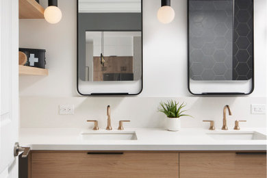 Example of a mid-sized minimalist master white tile and porcelain tile porcelain tile, black floor and double-sink bathroom design in Toronto with flat-panel cabinets, light wood cabinets, a one-piece toilet, white walls, an undermount sink, quartz countertops, a hinged shower door, white countertops and a floating vanity