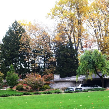 Frank Lloyd Wright inspired home with privacy berms