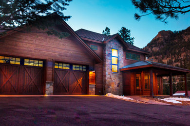 Large rustic brown two-story wood house exterior idea in Denver with a hip roof and a shingle roof