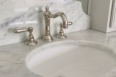 Inspiration for a large traditional master bathroom in San Francisco with louvered cabinets, grey cabinets, a freestanding tub, a corner shower, a one-piece toilet, gray tile, white walls, marble floors, an undermount sink, marble benchtops, grey floor, a hinged shower door and grey benchtops.
