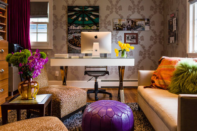 Example of a mid-sized trendy freestanding desk medium tone wood floor and brown floor home office design in New York