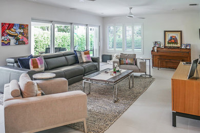 Example of a trendy beige floor living room design in Miami with a music area, white walls and no fireplace