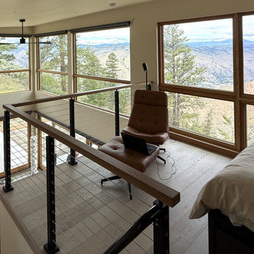 Modern rustic cabin loft with mountain views