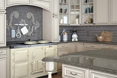 Kitchen pantry - large kitchen pantry idea in New York with recessed-panel cabinets, white cabinets, granite countertops and an island